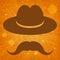 Hat with mustache on an orange background