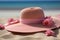 Hat in the sand A holiday mood conveyed with a pink straw hat