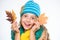 Hat and scarf keep warm. Kid wear warm knitted hat and long scarf. Fall fashion concept. Which fabrics will keep you