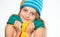 Hat and scarf keep warm. Kid wear warm soft knitted blue hat and long scarf. Warm woolen accessories. Girl long hair