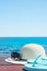 Hat Sunglasses Slippers on Blue Sky and Turquoise Sea Background. Summer Vacation Travel Relaxation. Idyllic Seascape View