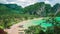 Hat Tom Sai Beach with long tail boats on the beach. Railay travel destination near Ao Nang, Krabi, Thailand