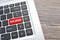 Hate speech key on red keyboard buttons representing online defamatory comments