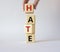 Hate symbol. Concept word Hate on wooden cubes. Businessman hand. Beautiful white background. Business and Hate concept. Copy