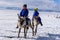 Hatgal, Mongolia, Febrary 25, 2018: Little tsaatan boys in traditional Mongolian riding on reindeers.