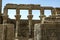 The Hathor capitals on the papyrus columns in the Temple of Nectanebo on Philae in Egypt.