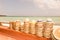 Hats salesman stand on the tropical beach