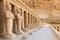 Hatshepsut statues by the columns on the highest terrace of the Mortuary Temple of Hatshepsut, Luxor