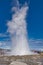 Haukadalur, Icleland -September 28, 2017: Strokkur that spouts its water about 20 meters up, tourists look at the geyser