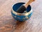 Haulerwijk - march 07 2020: Haulerwijk, The Netherlands. blue and golden indian singing bowl made of seven metals with a