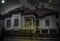 Haunted house with dark horror atmosphere and full moon. Creepy old mansion at night. Spooky scene like in frightening movies. Sty