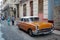 HAVANA, CUBA - 20 December 2016 : Old American cars are still a common sight in the backstreets of Havana, Cuba. Many are used as