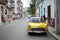 HAVANA CUBA - 20 December 2016 : Old American cars are still a common sight in the backstreets of Havana Cuba. Many are used as