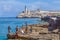 HAVANA, CUBA - APRIL 1, 2012: Teenagers swimming near Moro cast