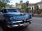 Havana, Cuba: Blue classic US car as taxi in Prado