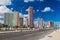 HAVANA, CUBA - FEB 21, 2016: Famous seaside drive Malecon in Havana. Skyline of Vedado neighborhood in the background