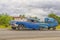 HAVANA, CUBA - JANUARY 04, 2018: A retro blue Chevrolet with a trailer rides on the road to Cuba