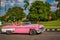 HAVANA, CUBA-OCT 25- Tourists enjoy a ride in antique cars used as taxis in Havana, on October 25, 2015 -2