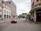 HAVANA, CUBA - OCTOBER 25, 2017: Havana Cityscape and Luxury Audi Car in Messy Havana Cityscape Background