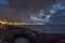 The Havana seaside skyline illuminated at night. Seen from across the bay