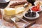 Havarti cheese and savory snacks with red wine