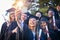 We have every reason to feel proud. a group of university students taking a selfie on graduation day.