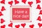 Have a nice message on greeting card with red hearts on white fabric