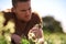 Have patience and watch great things grow. a young farmer looking at the crops on his farm.