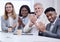 We havent seen work like yours in a while. a group of businesspeople clapping during a meeting in a modern office.