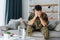 Having flashbacks. Post traumatic stress disorder. Soldier in uniform sitting indoors