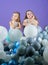 Having fun concept. Balloon birthday party. Girls little siblings near air balloons. Birthday party. Happiness and
