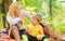 Having snack during hike. Happy childhood. Mom and kid boy relaxing while hiking forest. Family picnic. Mother pretty