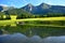 Havran and Zdiarska vidla, the two highest mountains in the Belianske Tatry. A pond and a flowery meadow in front. Slovakia