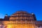 Hawa Mahal the most iconic symbol at Jaipur, capital city of Rajasthan, India. Dusk time with illuminated scenic facade and blue s