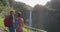 Hawaii Akaka Falls tourists at hawaiian waterfall during travel vacation