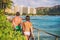 Hawaii beach surfing lifestyle. Surfers people walking with surfboards on Waikiki beach tourists on summer travel vacations