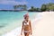 Hawaii beach vacation fun snorkel sport girl enjoying watersport activity going snorkeling with mask. Happy Asian woman in white