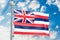 Hawaii flag waving in blue cloudy sky, 3D rendering