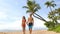 Hawaii holiday couple walking on Maui beach