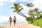 Hawaii holiday couple walking on Maui beach