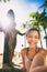 Hawaii summer vacation woman taking selfie photo on Waikiki Beach at Duke Kahanamoku statue, famous tourist attraction