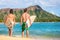 Hawaii surfers people relaxing on waikiki beach with surfboards looking at waves in Honolulu, Hawaii. Healthy active