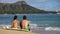 Hawaii surfers relaxing on waikiki beach with surfboards in Honolulu