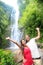 Hawaii tourist people happy by waterfall