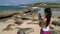 Hawaii - tourist taking photos of Hawaiian monk seals