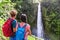 Hawaii tourists at waterfall couple backpackers