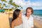 Hawaii travel beach couple laughing together happy on honeymoon vacation. People enjoying hawaiian sunset holidays