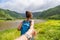 Hawaii travel nature hiker follow me woman hiking in Pololu valley holding hand of boyfriend following leading