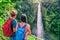 Hawaii travel tourists at waterfall landscape