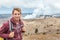 Hawaii volcano tourist man at Halemaumau crater in Kilauea caldera in Hawaii Volcanoes National Park, big Island with volcanic